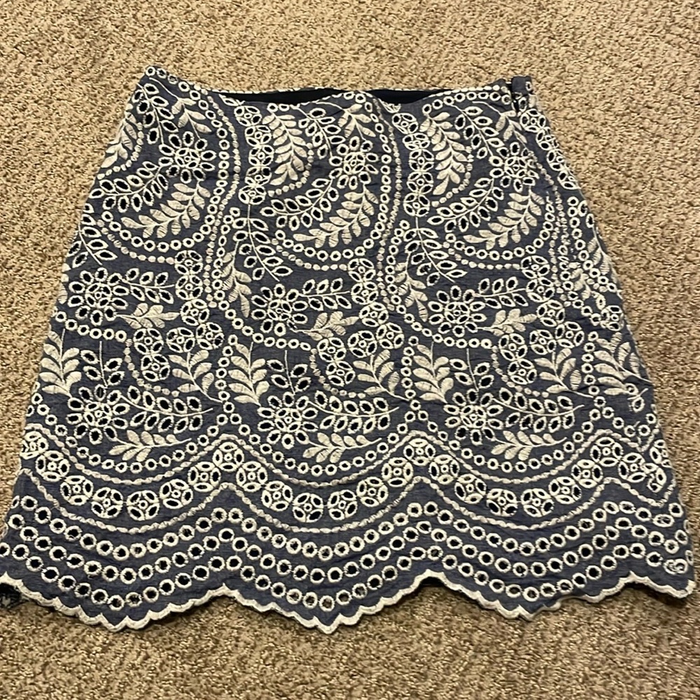 Loft summer skirt. Eyelet detail; chambray background.